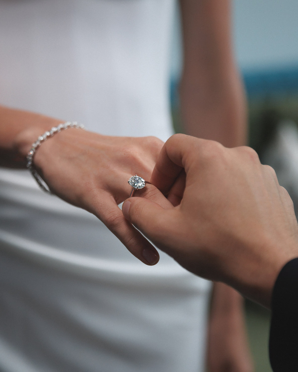 Her hand in his, the ring on her finger.