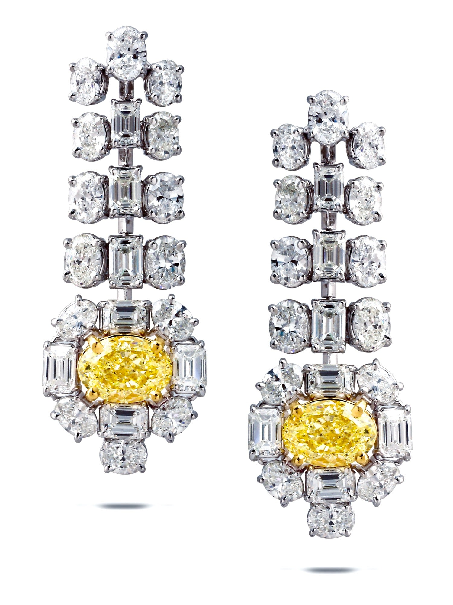 Seirios earrings — articulated white diamond line to a yellow oval diamond