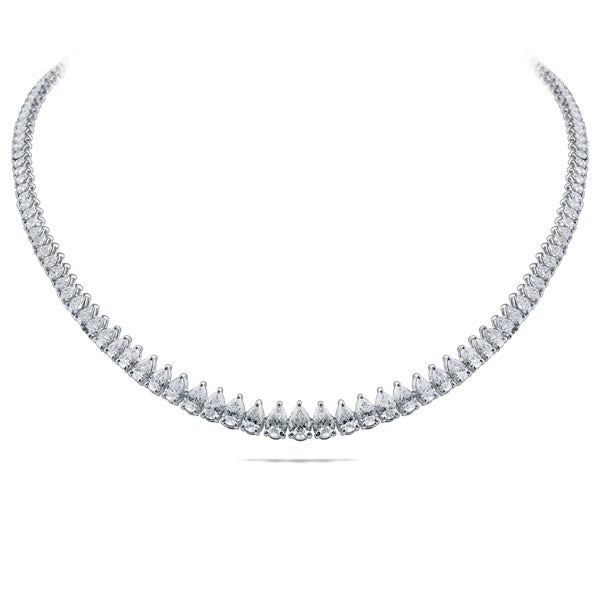 A rivière of graduated pear diamonds giving way to small rounds toward the nape, white gold.